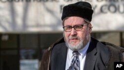 FILE - In this Feb. 19, 2015 file photo, Rabbi Bernard Freundel leaves the D.C. Superior Court House in Washington.