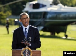 FILE - President Barack Obama delivers a statement at the White House in Washington on airstrikes in Syria, prior to departing for the United Nations in New York, Sept. 23, 2014.