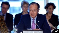 FILE - World Bank Group President Dr. Jim Yong Kim speaks during a World Bank Group town hall at the World Bank Group in Washington.