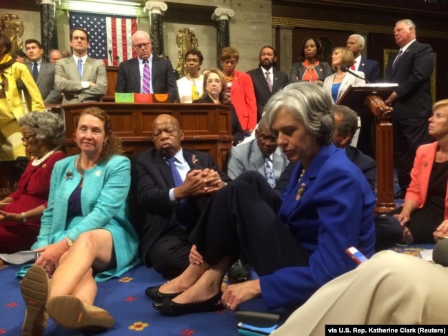 FILE - A photo shot and tweeted from the floor of the U.S. House of Representatives shows Democratic members of the House staging a sit-in on the House floor "to demand action on common sense gun legislation" on Capitol Hill, in Washington, June 22, 2016.