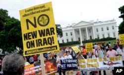 Demonstrators protest outside of the White House in Washington against renewed U.S. involvement in Iraq in Washington, D.C., June 21, 2014.