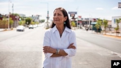 FILE - Deb Haaland poses for a portrait in a Nob Hill Neighborhood in Albuquerque, N.M., June 5, 2018. Haaland, a tribal member of Laguna Pueblo, became the first Native American woman in Congress.