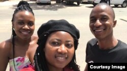 Joanna Mamombe with two members of the MDC.