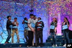 The eight co-champions of the 2019 Scripps National Spelling Bee celebrate their win in Oxon Hill, Md., May 31, 2019.