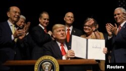 U.S. President Donald Trump is applauded after signing an Executive Order on US-Cuba policy in Miami, Florida, U.S. (File)