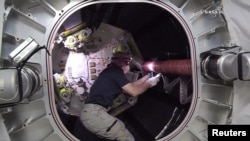 NASA astronaut Jeff Williams works inside the Bigelow Expandable Activity Module (BEAM) attached to the International Space Station in this still image from NASA TV taken June 6, 2016.