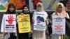 Para aktivis gerakan anti-kekerasan terhadap perempuan menggelar unjuk rasa memprotes kekerasan dan pelecehan seksual terhadap perempuan di kampus, di luar Kementerian Pendidikan dan Kebudayaan, di Jakarta, 10 Februari 2020. (Foto: AFP)