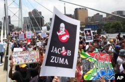 FILE - Demonstrators take part in a protest march across the Nelson Mandela bridge into Johannesburg, Dec. 16, 2015. Protesters were calling for President Jacob Zuma to be removed amid allegations of corruption.