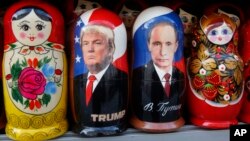 Traditional Russian wooden dolls depicting U.S. President Donald Trump and Russian President Vladimir Putin are displayed for sale at a street souvenir shop in St. Petersburg, Russia, Jan. 20, 2017.