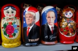 Traditional Russian wooden dolls depicting U.S. President Donald Trump and Russian President Vladimir Putin are displayed for sale at a street souvenir shop in St. Petersburg, Russia, Jan. 20, 2017.