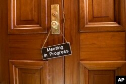 A sign hangs on the Senate Appropriations Committee room at the Capitol as bipartisan House and Senate bargainers trying to negotiate a border security compromise in hope of avoiding another government shutdown, in in Washington, Feb. 11, 2019.