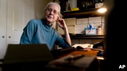 Detta Kissel, a former Treasury Department attorney, poses for a photograph at her home in Arlington, Va., Wednesday, Sept. 8, 2021. (AP Photo/Andrew Harnik)
