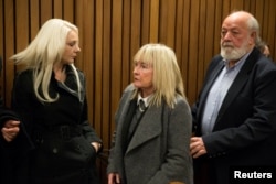 June and Barry Steenkamp leave the court after the sentence hearing of Olympic and Paralympic track star Oscar Pistorius at the North Gauteng High Court in Pretoria, South Africa, July 6, 2016.