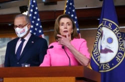 FILE - Speaker of the House Nancy Pelosi, D-Calif., joined by Senate Majority Leader Chuck Schumer, D-N.Y., speaks to reporters at the Capitol in Washington, Sept. 23, 2021,