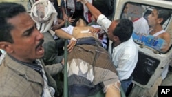 An injured opposition fighter rushed to a hospital after clashes with government security forces in the southern city of Taiz, Yemen, November 2, 2011.