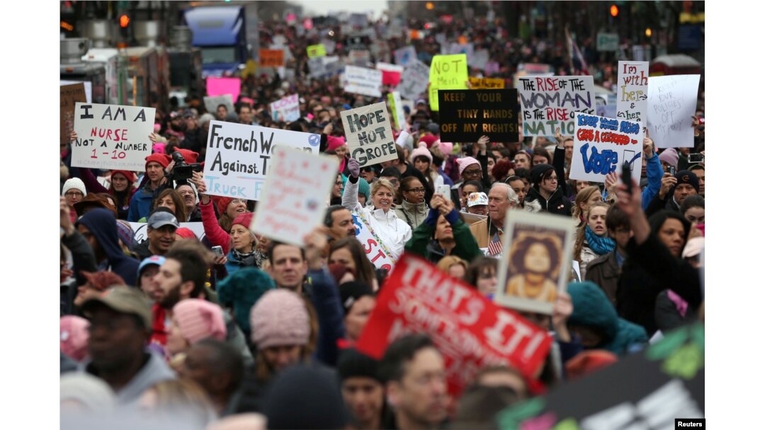 FILE - People participate in the Women's March on Washington, following the inauguration of President Donald Trump, in Washington, D.C., Jan. 21, 2017.