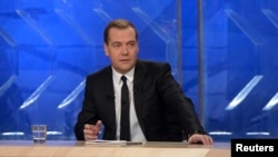 Russian Prime Minister Dmitry Medvedev gives an interview to federal TV channels at the Ostankino TV Center In Moscow, Dec. 6, 2013. 