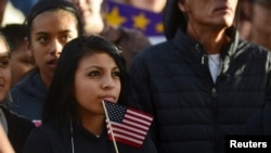 FILE - Latino leaders and immigration reform supporters gather on University of Colorado campus to launch a voter registration campaign to mobilize Colorado's Latino, immigrant and allied voters, Oct. 28, 2015.