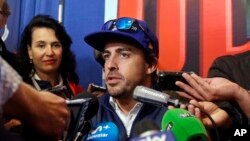 Fernando Alonso, of Spain, answers a question during a press conference for the Indianapolis 500 auto race at Indianapolis Motor Speedway, May 25, 2017, in Indianapolis. 