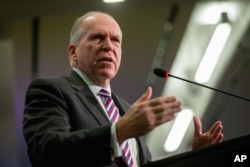 FILE - CIA Director John Brennan responds to a reporter's question.