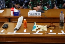 Debris from the missing Indonesian Navy KRI Nanggala-402 submarine are displayed during a media conference at Ngurah Rai Airport in Bali, Indonesia, April 24, 2021. REUTERS/Johannes P. Christo