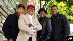 Marlon Jackson, 2nd from left, Tito Jackson, 2nd from right, and Jackie Jackson, far right, brothers of the late musical artist Michael Jackson, and Tito's son Taj, far left, pose together for a portrait outside the Four Seasons Hotel, in Los Angeles, Feb. 26, 2019.