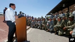 Arizona Republican Gov. Doug Ducey speaks to Arizona National Guard soldiers prior to deployment to the Mexico border at the Papago Park Military Reservation in Phoenix, April 9, 2018.