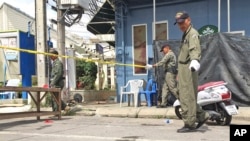Investigators work at the scene of an explosion in the resort town of Hua Hin, 240 kilometers (150 miles) south of Bangkok, Thailand, Aug. 12, 2016.