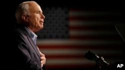 FILE - Then-Republican presidential candidate Sen. John McCain speaks at a rally in Davenport, Iowa, Oct. 11, 2008.