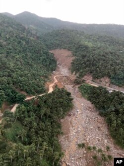 An aerial view of one of several landslides in Camarines Sur province in the Bicol region south of the main island of Luzon, is seen as President Rodrigo Duterte conducts an inspection, Jan. 4, 2019,