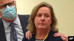 In this screen grab from video, former Brooklyn Center Police Officer Kim Potter stands with her attorney as the guilty verdict for manslaughter is read, Dec. 23, 2021, at the Hennepin County Courthouse in Minneapolis. 