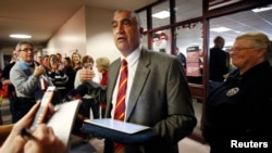 Salt Lake County District Attorney Sim Gill announces that the issuing of marriage licenses will continue at the Salt Lake County Clerk's office in Salt Lake City, Utah, Dec. 23, 2013.