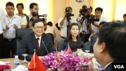 Var Kim Hong, chairman of the Cambodian Government Border Committee, talks to his Vietnamese counterpart, H.E. Ho Xuan Son, Deputy Minister of Foreign Affairs in a close door bilateral meeting at Council of Ministers in Phnom Penh, Cambodia, July 7, 2015