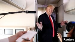 U.S. President Donald Trump speaks to the press aboard Air Force One en route to Bedminster, New Jersey, from Joint Base Andrews, Maryland, June 29, 2018.