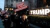 People gather to protest U.S. President Donald Trump's declaration of a national emergency to build a border wall, at Trump International Hotel & Tower in New York, Feb. 15, 2019.