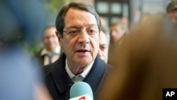 Cypriot President Nicos Anastasiades speaks with the media after an emergency eurogroup meeting in Brussels, March 25, 2013.