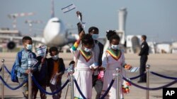FILE - Ethiopian immigrants arrive at Ben Gurion Airport near Tel Aviv, Israel, Dec. 3, 2020. Israel’s government has approved entry for several thousand Ethiopian Jews Nov. 28, 2021.