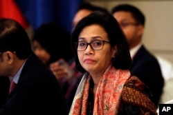 FILE - Indonesia's Finance Minister Sri Mulyani Indrawati listens to the opening remarks at the start of the 8th ASEAN Finance Ministers' Meetings on Friday, April 6, 2018, in Singapore.