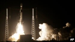 A SpaceX Falcon 9 rocket lifts off with Israel's Lunar Lander and an Indonesian communications satellite at space launch complex 40, Thursday, Feb. 21, 2019, in Cape Canaveral, Fla. (AP Photo/Terry Renna)