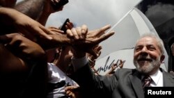 Brazil's former president Luiz Inacio Lula da Silva attends a rally in the northeastern city of Lagarto in Sergipe, Brazil, Aug. 21, 2017. 