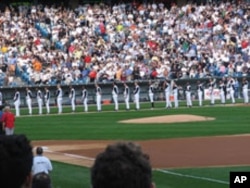 Nine of the Chicago White Sox' 25 players, shown here at attention during the playing of the U.S. national anthem, are Latinos. None is of Asian heritage.
