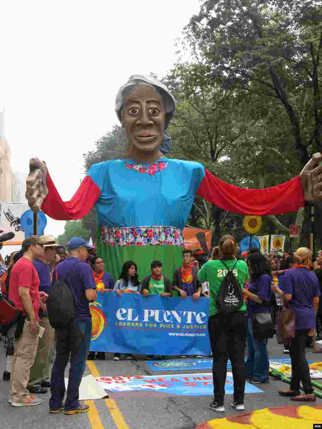 Part parade, part protest, colorful floats lined the route from Central Park to the United Nations in New York, Sept. 21, 2014. (Rosanne Skirble/VOA)