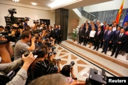 Social Democrat leader Zoran Zaev poses for a photo with newly elected ministers at Macedonian parliament in Skopje, Macedonia June 1, 2017.