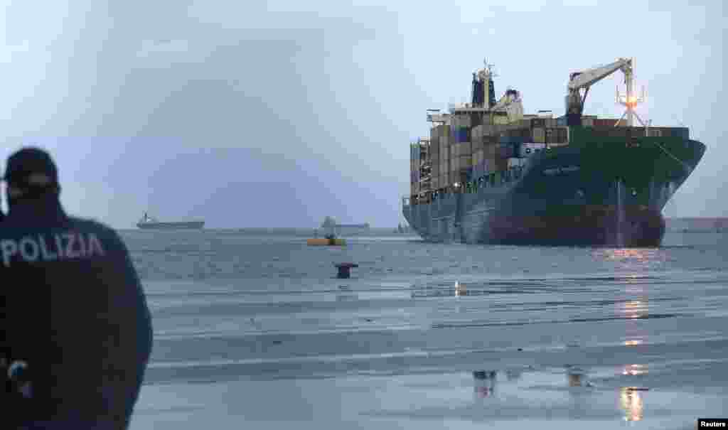 The "Spirit of Piraeus " cargo container ship, transporting passengers from the car ferry Norman Atlantic after it caught fire in waters off Greece, is pictured after arriving at Bari harbor, December 29, 2014.