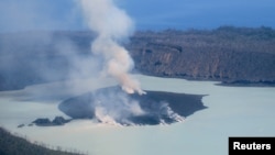 FILE - Smoke and ash emanate from the Manaro Voui volcano on Vanuatu's northern island Ambae in the South Pacific, Oct. 1, 2017.