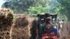 FILE - An old steam locomotive take pull sugar bucket at Karanganyar, Central Java, Indonesia, in the undated file photo. Indonesian authorities arrested a formed trade minister accused of issuing a sugar import permit when Indonesia had a surplus of sugar. 