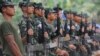 Karen National Union (KNU) soldiers hold their assault weapons as they parade during the celebration of the 63rd anniversary of the Karen Revolution day at Oo Kray Kee village in Karen State, near the Thai-Myanmar border on January 31, 2012. The KNU is w