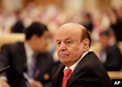 FILE - the President of Yemen Abed Rabbo Mansour Hadi, participates in a summit of Arab and South American leaders in Riyadh, Saudi Arabia.