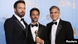 Producer and director Ben Affleck (L) poses with "Argo" producers Grant Heslov (C) and George Clooney after Affleck won Best Director and "Argo" won the award for Best Motion Picture Drama at the 70th annual Golden Globe Awards in Beverly Hills, Californi