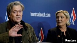 FILE - Marine Le Pen, National Front (FN) political party leader, and former White House Chief Strategist Steve Bannon attend a news conference during the party's convention in Lille, France, March 10, 2018. 